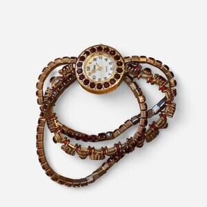 Gold tone wrap bracelet watch